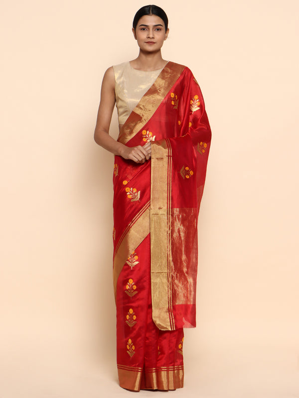 A red chanderi with golden zari but dainty yellow floral buttas - a very masterpiece you cant take your eyes off! Saree is handwoven in chanderi in pure silk with the finest eknaliya/kadhwa buttis. 