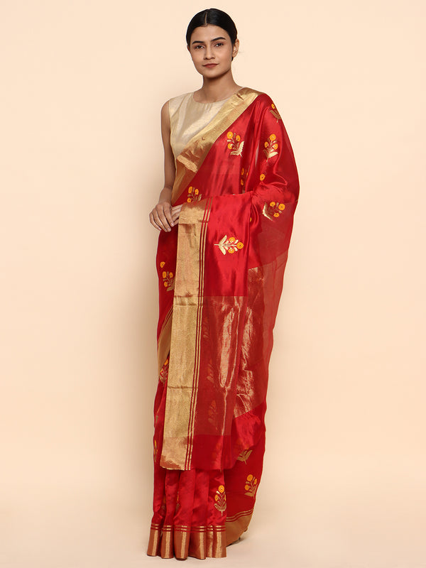 A red chanderi with golden zari but dainty yellow floral buttas - a very masterpiece you cant take your eyes off! Saree is handwoven in chanderi in pure silk with the finest eknaliya/kadhwa buttis. 