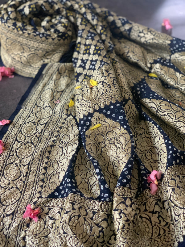 Enrich Your Wardrobe With Dark Blue Georgette Bandhini dupatta, rich neem zari woven on pure georgette is lite and royal at the same time Dupatta is a pure georgette banarsi machine made fabric with hand tie dyed bandhej knots in white